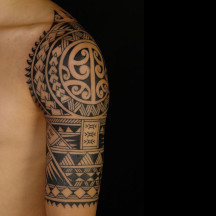 traditional tribal maori polynesian tattoo design - example of mens arm sleeve tattoo