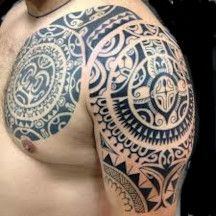 tribal polynesian chest-shoulder tattoo